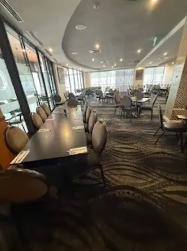 Patterned carpet in a function room with dining tables