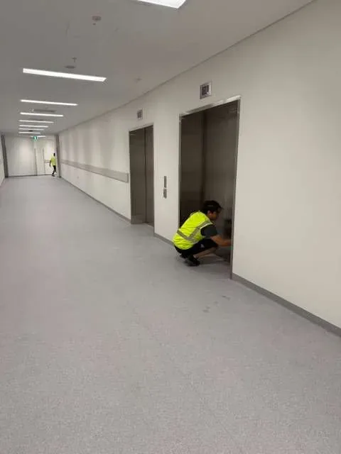 Office corridor being cleaned by a Living Fresh cleaner
