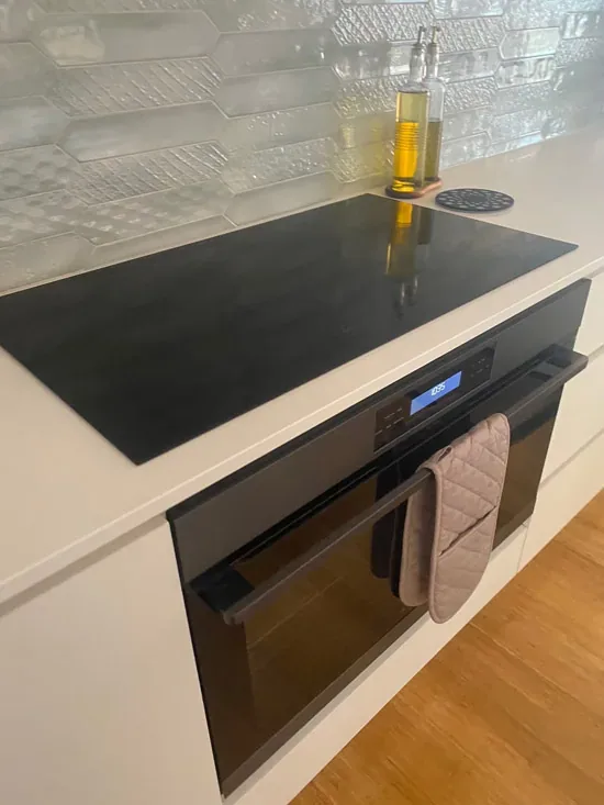 Induction cooktop and wall oven after a kitchen clean