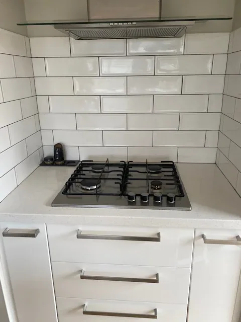 Kitchen splashback, cooktop and drawers after cleaning