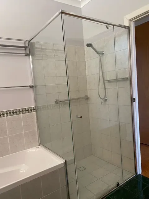 Clean glass shower screen and tiled shower