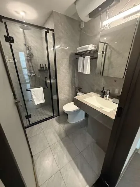 Walk-in shower and bathroom after a professional house clean