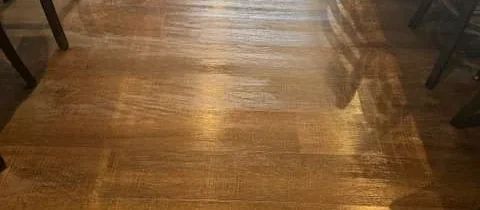 Polished timber floor and seating in a venue after floor care